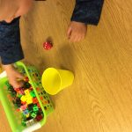 Each player rolls a die and fills their cup with that many cubes. When all cups are full they count their cubes. Player with the most wins.