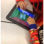 Students using technology as one centre during guided math