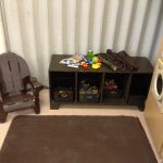 A seat and a choice of different fidget toys, books and sensory objects for children to use