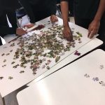 Grade 9 students begin working on the puzzle