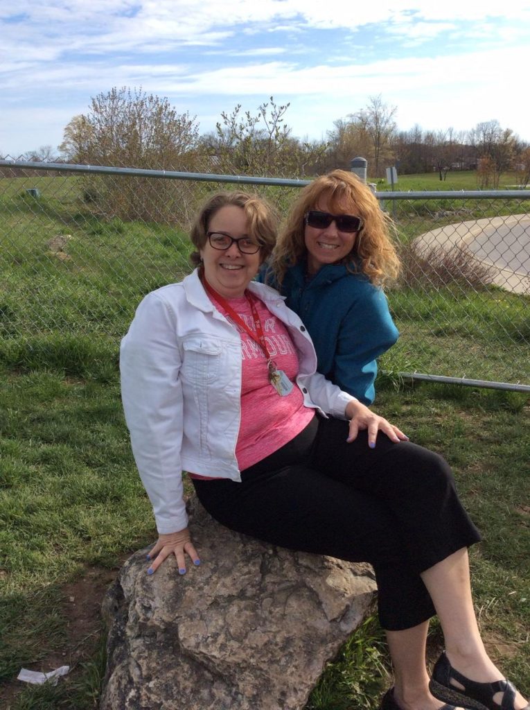 The two of us in the schoolyard on one of our large rocks.